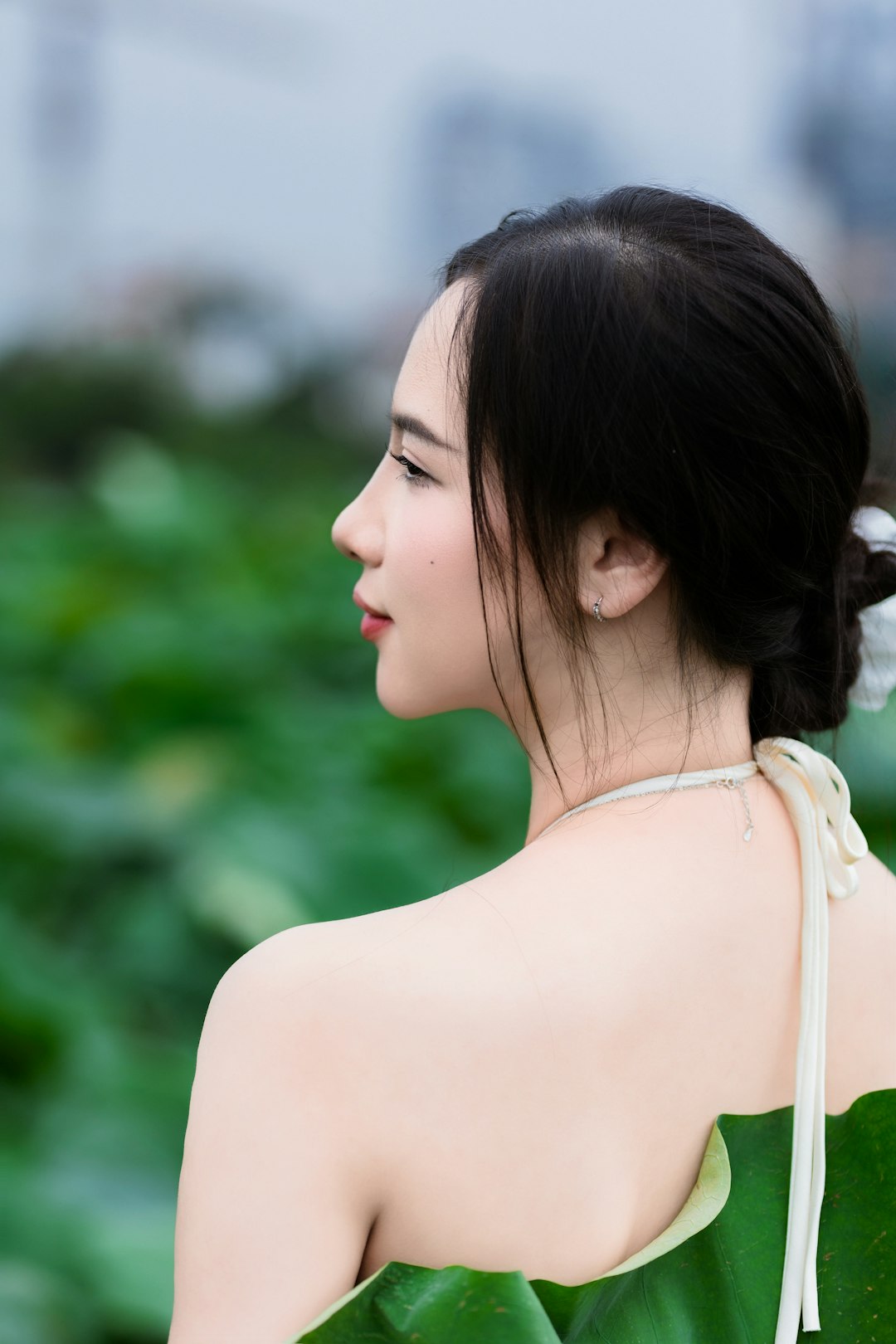 our-story Portrait of woman with lotus